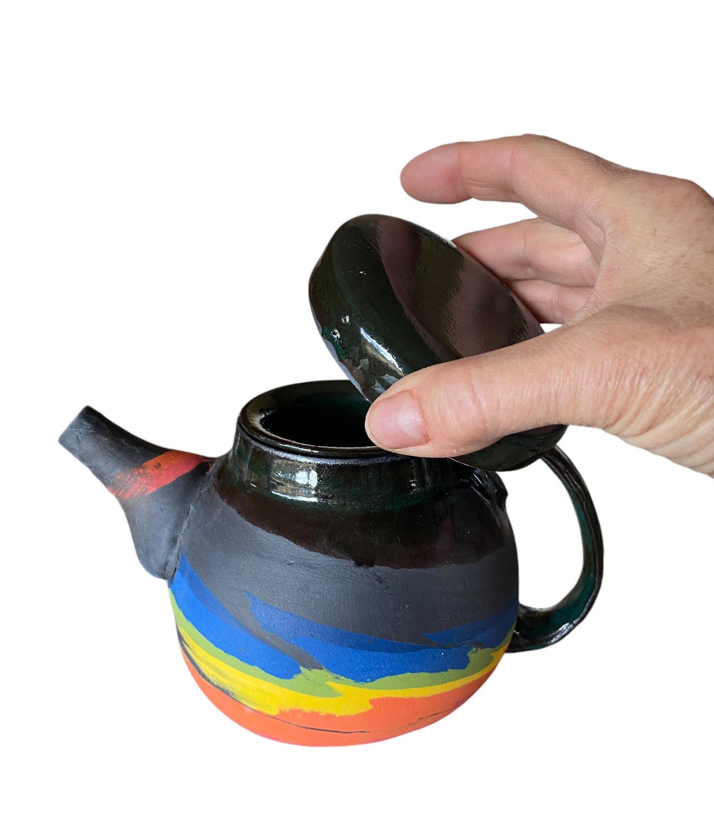 A 2-cup teapot made from black clay, featuring intricate inlays of layered colored clay.