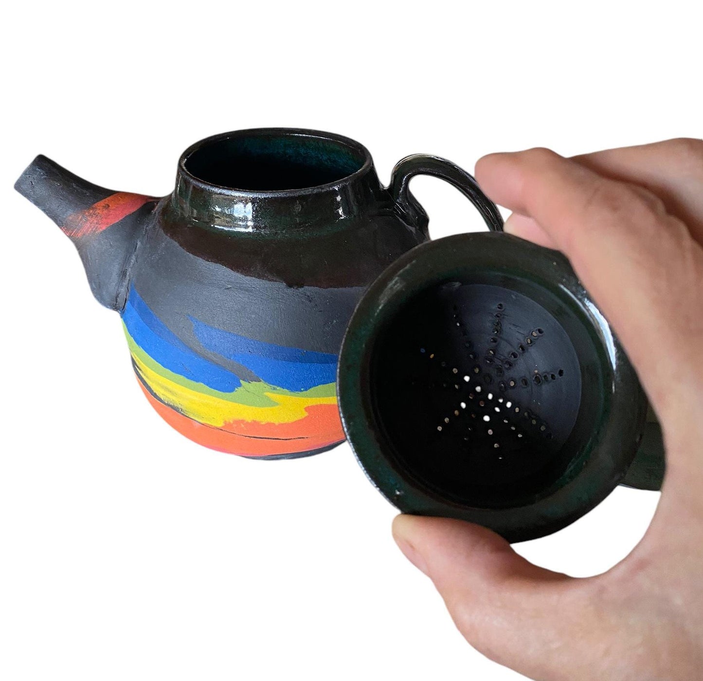 A 2-cup teapot made from black clay, featuring intricate inlays of layered colored clay.