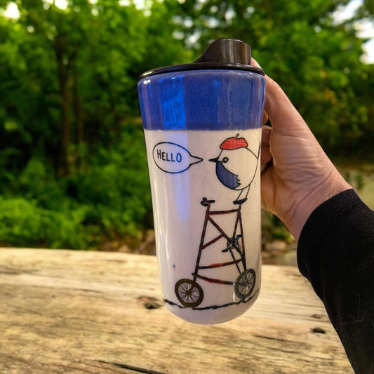 Reactive Blue Glaze 16 -Ounce Travel Mug With Locking Lid Embellished with A Bird Riding a Bike With  - Unique Pottery Mug